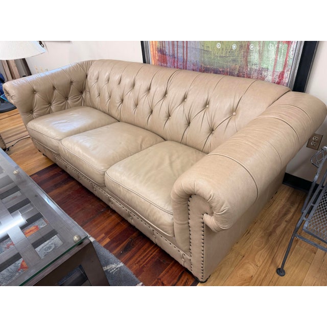 A handsome Bernhardt leather chesterfield sofa with classic English-inspired lines and an inviting, tailored presence. The...