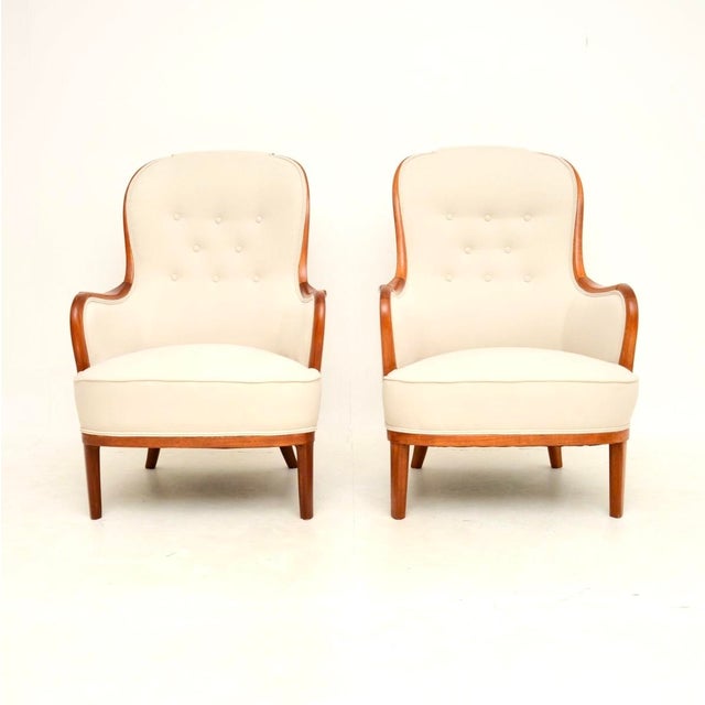 A stunning and exceedingly rare pair of vintage Swedish armchairs by Carl Malmsten. They were recently imported from...
