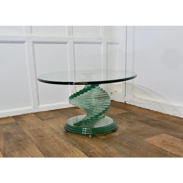 1970s Retro Design Glass Coffee Table set on a Glass Spiral Helix This thrilling style was originally designed by Danny...