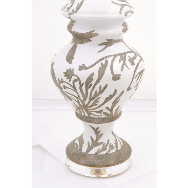 This pair of scenic silhouette lamps have a delightful crackle finish to the white porcelain. The gray, natural portion...