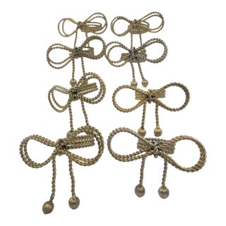 Late 20th Century Hollywood Regency Gold-Tone Metal Rope Bow Napkin Rings - Set of 8 For Sale