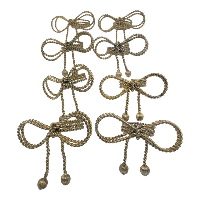 Late 20th Century Hollywood Regency Gold-Tone Metal Rope Bow Napkin Rings - Set of 8 For Sale