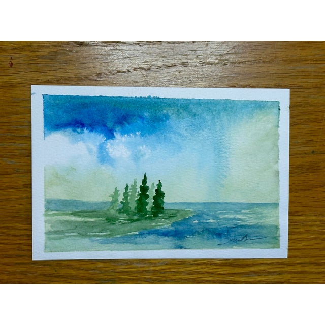 A pleasing stand of trees on a peninsula. Signed and ready to frame.