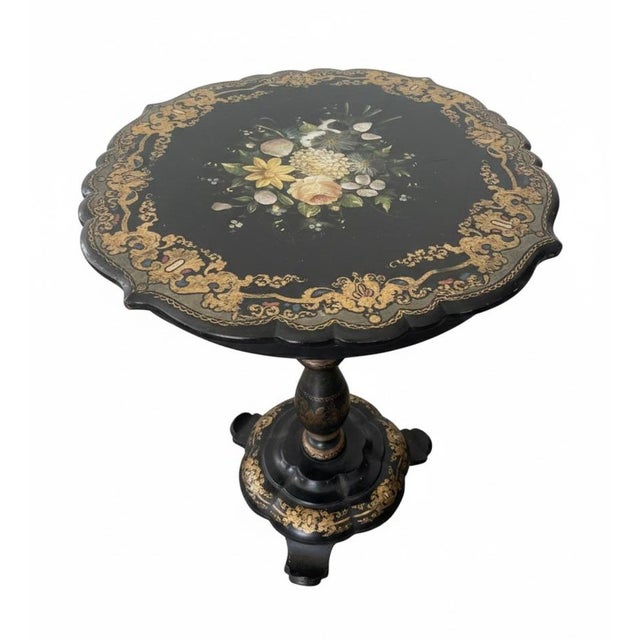 Exquisite Victorian-era pedestal side table featuring a scalloped "pie crust" rim and a rich, black lacquered finish. This...