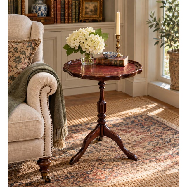 A handsome Georgian-style drinks table crafted in rich mahogany and finished with a beautifully embossed burgundy leather...