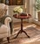 A handsome Georgian-style drinks table crafted in rich mahogany and finished with a beautifully embossed burgundy leather...