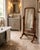An antique Victorian mahogany freestanding cheval mirror with a large adjustable rectangular plate, turned supports and an...