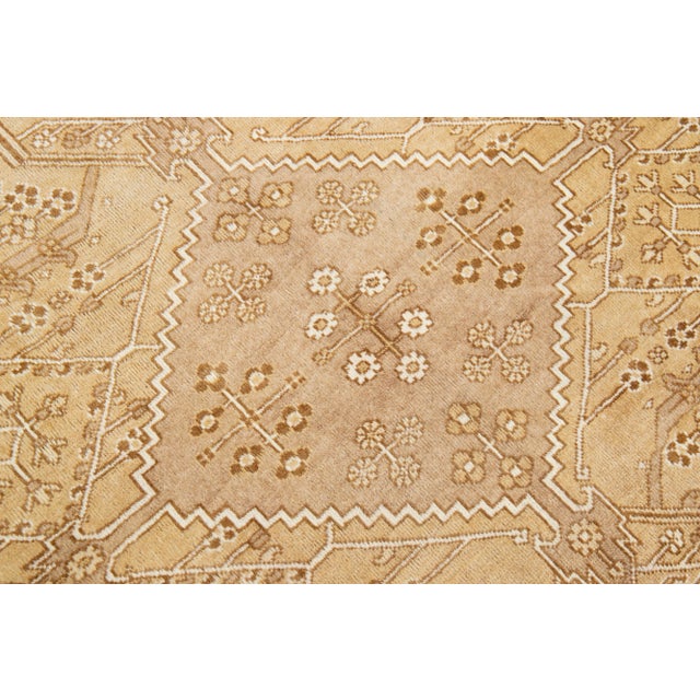 Beautiful vintage Persian Joshegan hand-knotted wool rug with a beige field. This piece has a beige frame and brown...