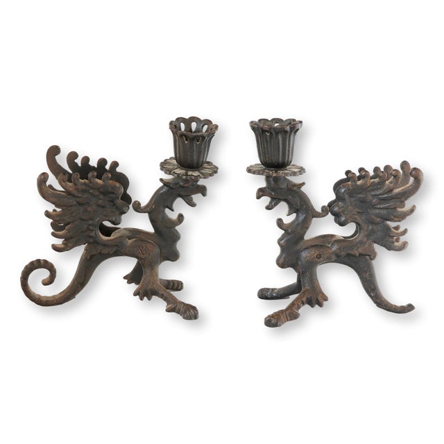 Because every dinner table deserves a touch of drama—and possibly a mythical creature or two. This pair of midcentury cast...