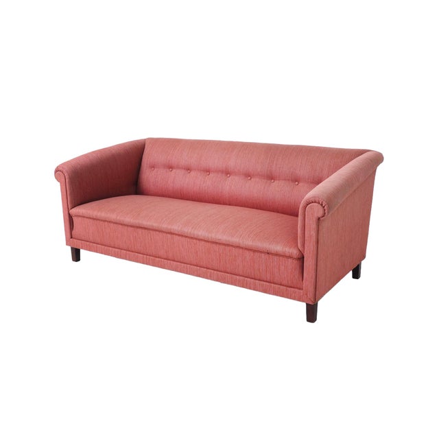 Crafted in the 1950s in the style of Swedish designer Carl Malmsten, this tailored sofa is characterized by smooth lines...