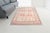 Add an authentic, artisanal touch to your home with this exquisite vintage Turkish rug. This piece features a cream-...