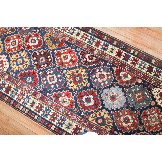 A late 19th-century tribal connoisseur-level Caucasian Shirvan Runner. Measures: 3'3" x 12'6".