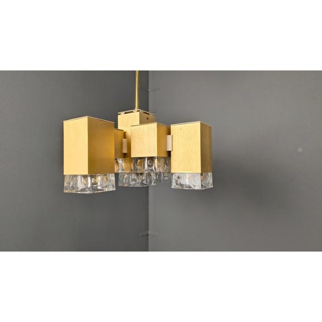 Vintage brass chandelier with glass shades. The chandelier has 9 lights and emits a beautiful light. Good condition. The...