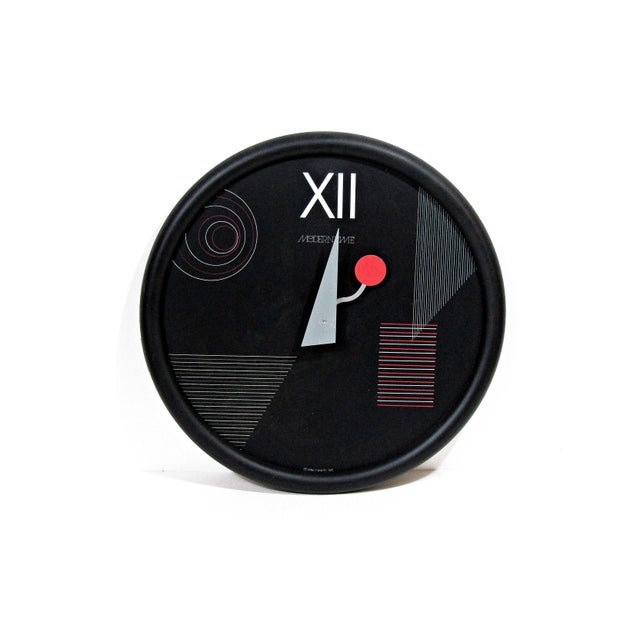 A striking 1986 Canetti Inc. “Modern Time” wall clock with a bold Postmodern / Memphis-inspired design. The round black...