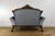 This magnificent late 19th-century Victorian settee is a breathtaking testament to old-world elegance and master-level...