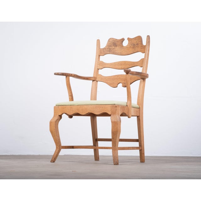 A striking brutalist oak armchair designed by henning (henry) kjærnulf for e.g. Møbler, produced in the 1960s. Crafted in...
