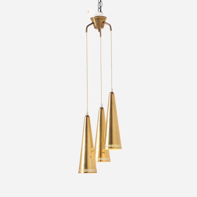 Three-Armed Pendant by Mauri Almari for Idman Finland, c1950s Three shiny brass model ‘K2-48’ shades, held together by a...