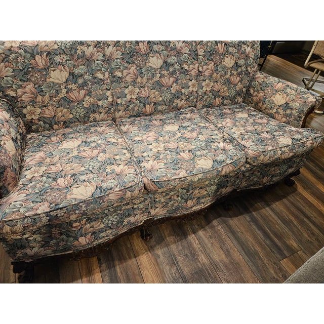Antique Florencia Sofa with dark cherry intricately carved feet and front apron. This piece has been in my family four...