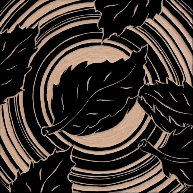 This hand-carved maple artwork features a dynamic composition of stylized leaves swirling around a central vortex, evoking...