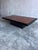 This striking vintage coffee table combines the warm, expressive character of burl wood veneer with a bold black lacquered...