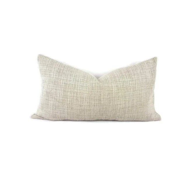 The face is called Sumptuous in the color Meringue. This lovely grayish tan with white chenille pillow covers are from Lee...