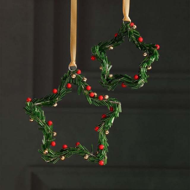 Celebrate the season with these festive beaded ornaments, thoughtfully crafted from iron and glass in either star or round...