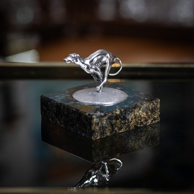 Vintage 20th century english solid silver statue on a marble base, modelled as a greyhound in full stride, capturing the...