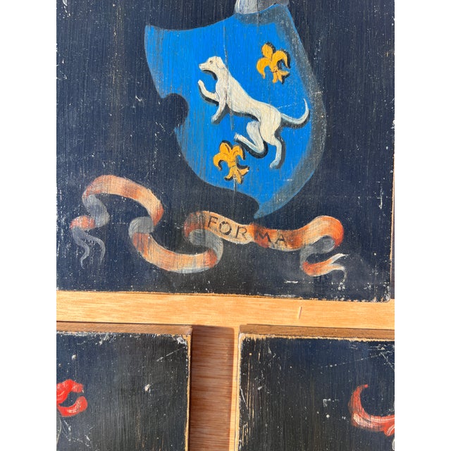 Set of three oil on wood wall hanging painting panels. Each panel displays a coat of arms for a noble Italian family, with...