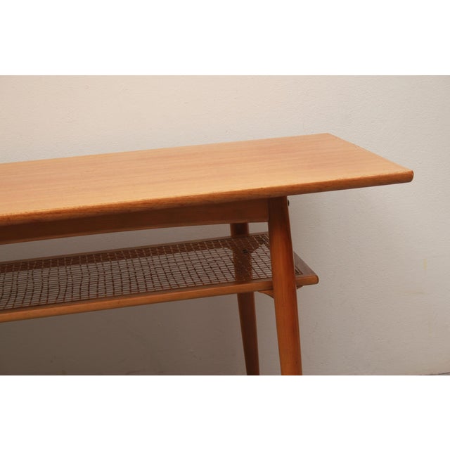 Simple coffee table in Scandinavian style. Manufactured by Opal Möbel in the 60s. Teak veneered table top. Base frame in...