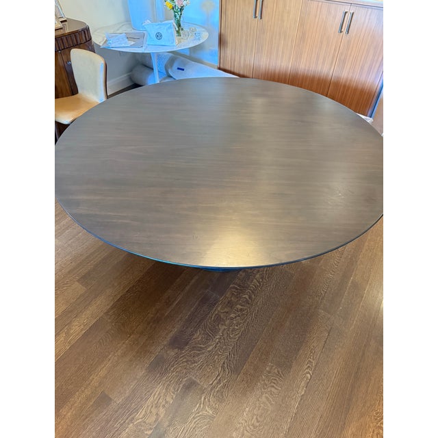 Beautiful restoration hardware aero table. Dark brown walnut top, cast iron base. Been used for 3 dinners. Practically...