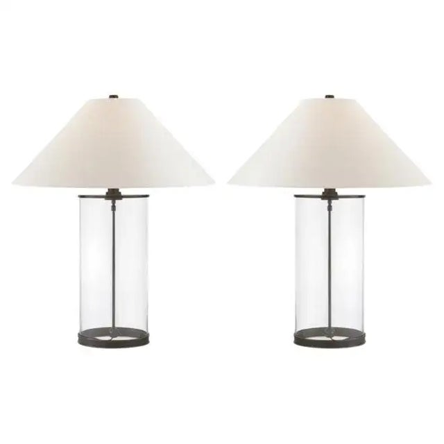Pair of contemporary minimalist table lamps by Ralph Lauren. These spectacular modern lamps feature a clear glass cylinder...