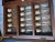 Late 20th Century Vintage Art Deco Style Painted Glass Panel Spice Rack Cabinet With 30 Bottles For Sale - Image 9 of 12