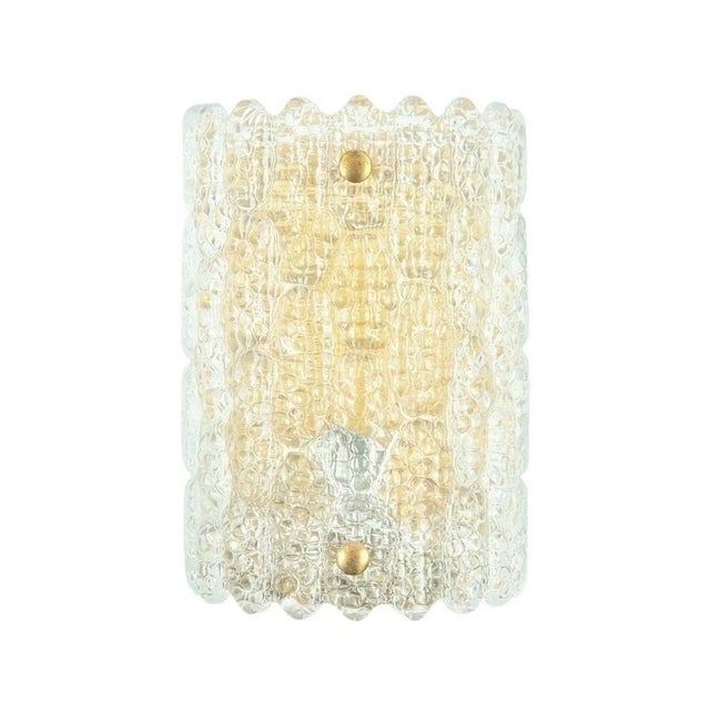 Stunning glass & brass wall light/sconce designed by Carl Fagerlund for Orrefors (Sweden, 1960s). Thick textured art glass...