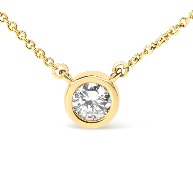 Embrace simplicity with a touch of timeless elegance with this exquisite pendant necklace, masterfully wrought from 10K...