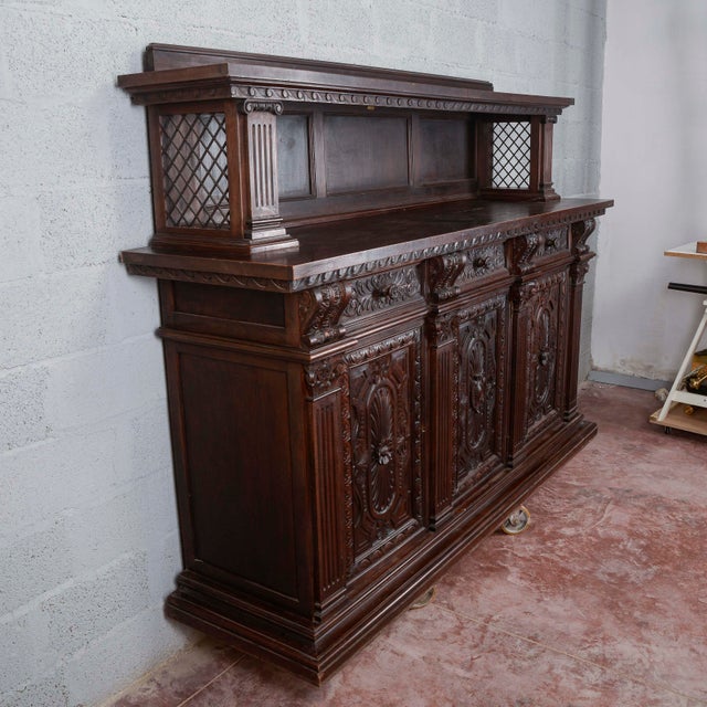This imposing late 19th-century sideboard with a plate rack expresses the monumental taste and majesty of the Italian Neo-...