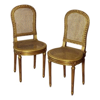 1920s Pair of Antique French Louis XVI Style Giltwood and Cane Side Chairs For Sale
