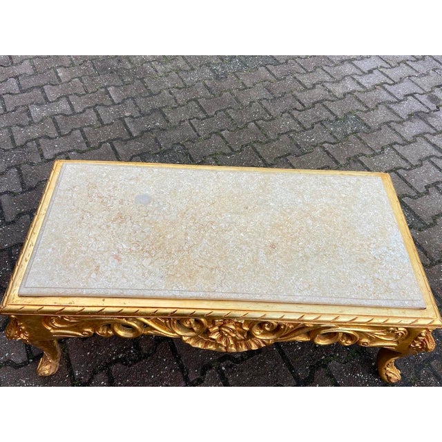 Make a bold and elegant statement with this exceptional Italian Baroque coffee table, crafted in Italy during the 1970s....