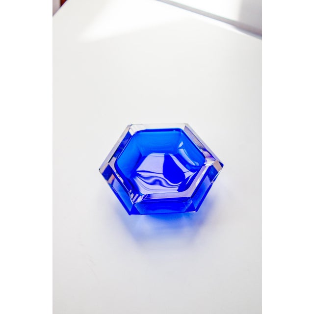 Stunning cobalt blue cut glass ashtray in the renowned Sommerso style of Murano. A sculptural piece with hypnotic...