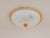 Beautiful ocher yellow and clear ice glass flush mount. Made by Barovier and Toso around the 1970s in Italy. The lamp...