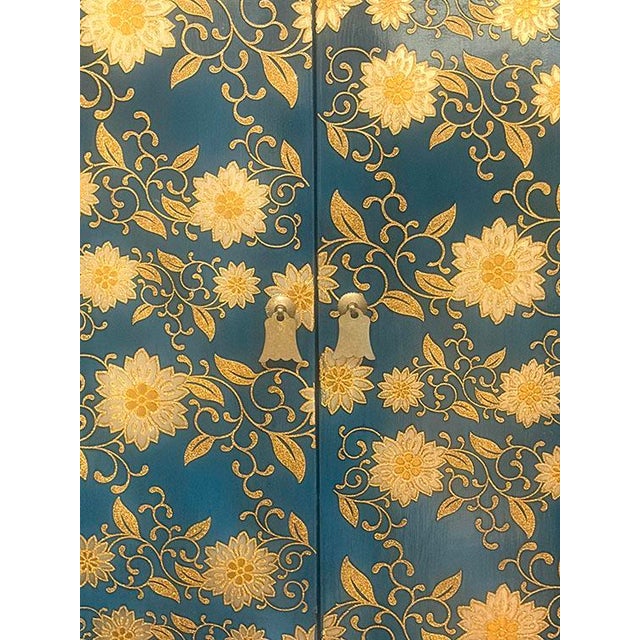 This Tibetan hand painted tall cabinet is made out of elm wood. It has 2 doors and 5 drawers. It is very elegant piece to...