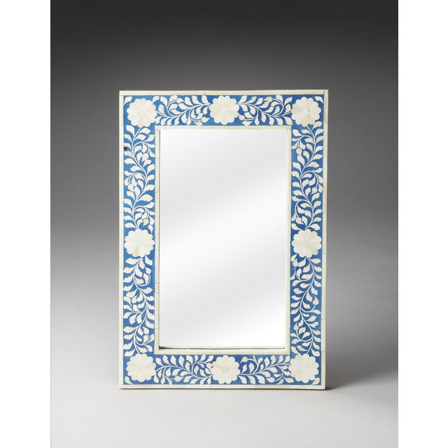 This exquisite wall mirror from Butler Specialty Company showcases refined artistry and exceptional craftsmanship. Adorned...