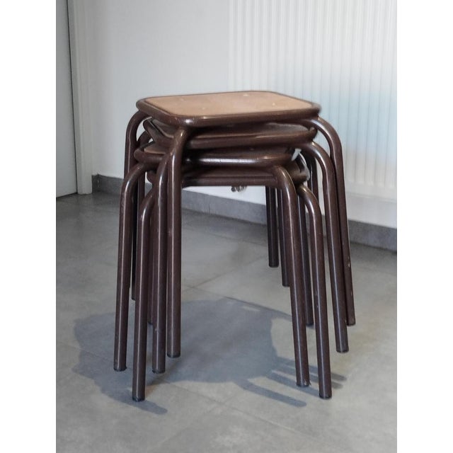Set of 4 vintage stools. set of 4 workshop, school, or factory stools by m u l l c a. practical and stackable. industrial...