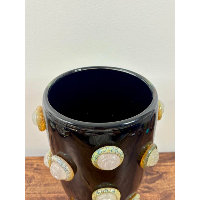 Striking monumental vintage Italian Murano art glass vase featuring a dramatic glossy black body adorned with sculptural...