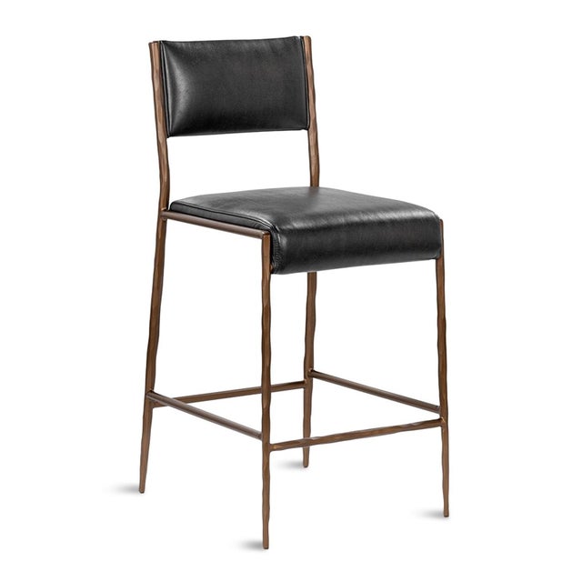 Antiqued bronze finish hammered iron frame counter stool with black leather upholstered seat and back.