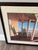 Offered here is a framed coastal print by Daniel Pollera, likely dating to the c. 1990s-2000s. The print has the printed...