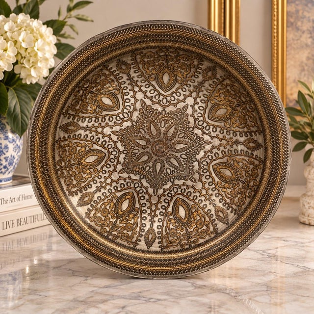 Striking large-scale decorative bowl featuring a richly textured raised design and substantial dimensional form. The...