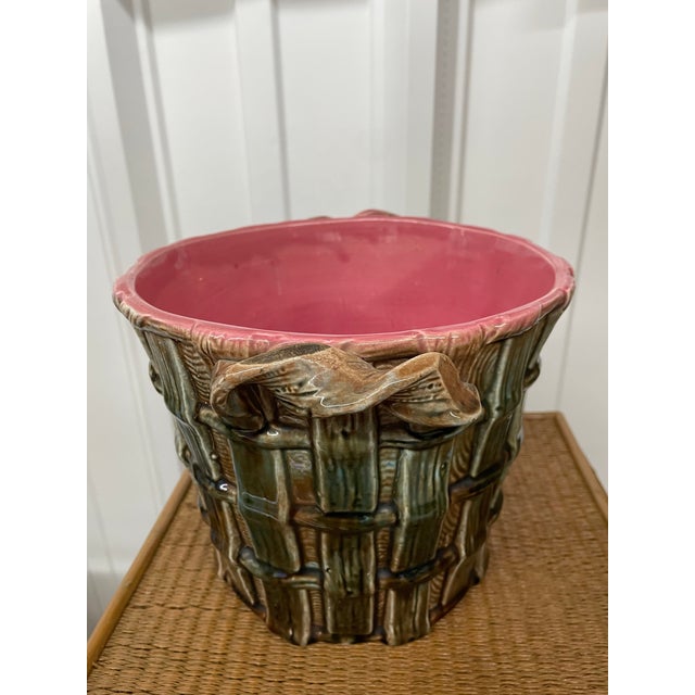 Beautiful basketweave pattern antique majolica planter or cache pot with twist handles. Muted green colors with a vibrant...