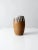 A vintage studio pottery vase, signed by the artist, showcasing a thoughtful balance of natural material and expressive...