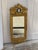 A vintage Gustavian style gilt wood rectangular wall mirror with a beveled mirror plate, beaded and rope-twist gilt frame,...