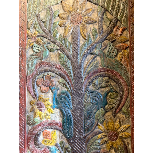 Bring warmth and artistry to your home with this vintage hand-carved wood barn door wall panel, featuring an intricate...